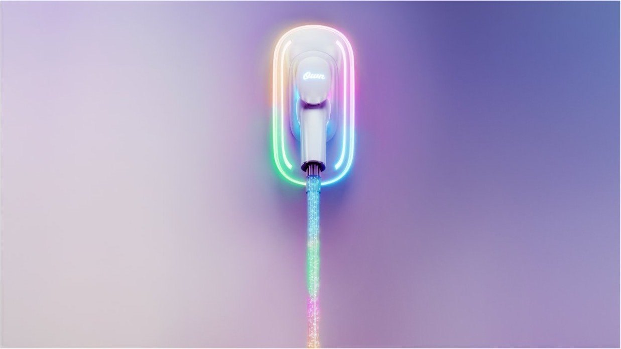 Rainbow-lit charging nozzle on a lavender wall