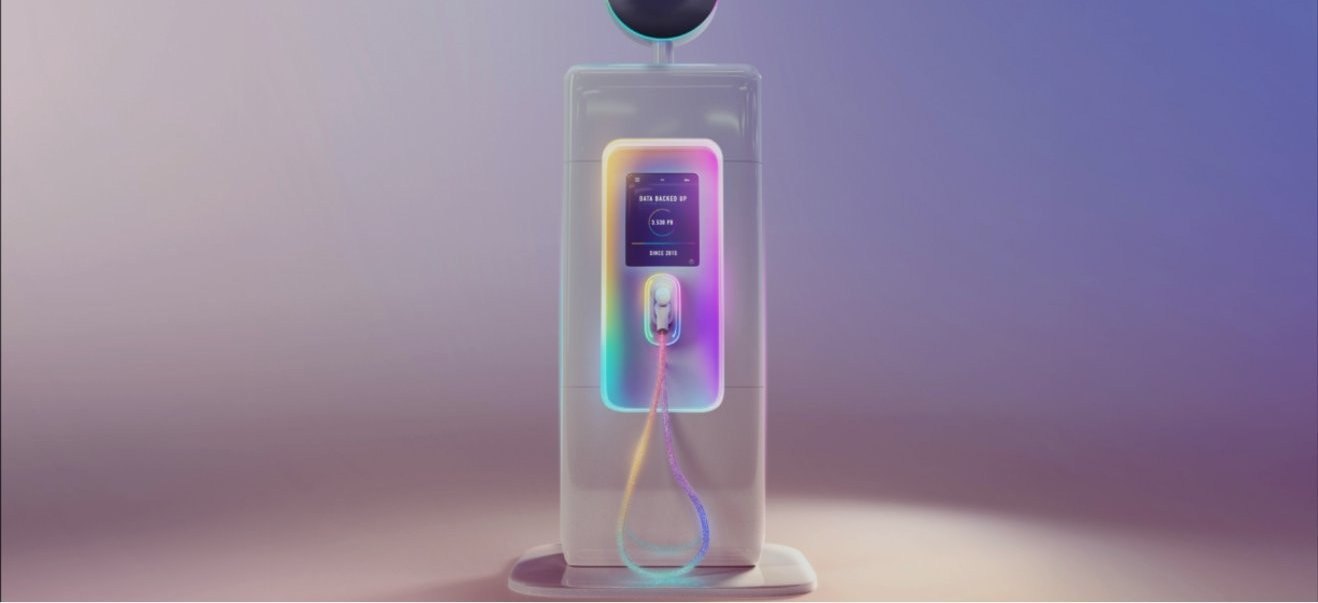 Iridescent data fueling station topped with the Own logo