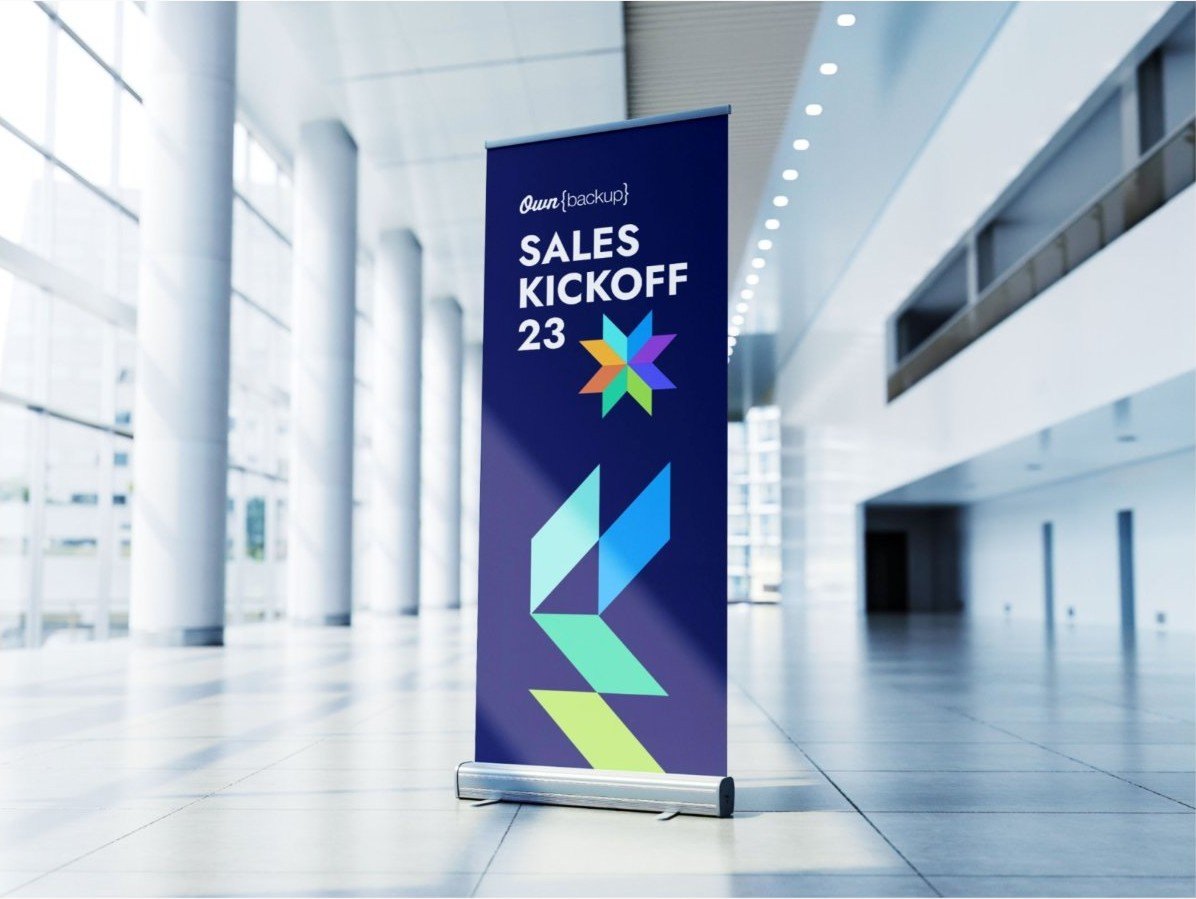 Sales Kickoff 23 roll-up banner in a bright lobby