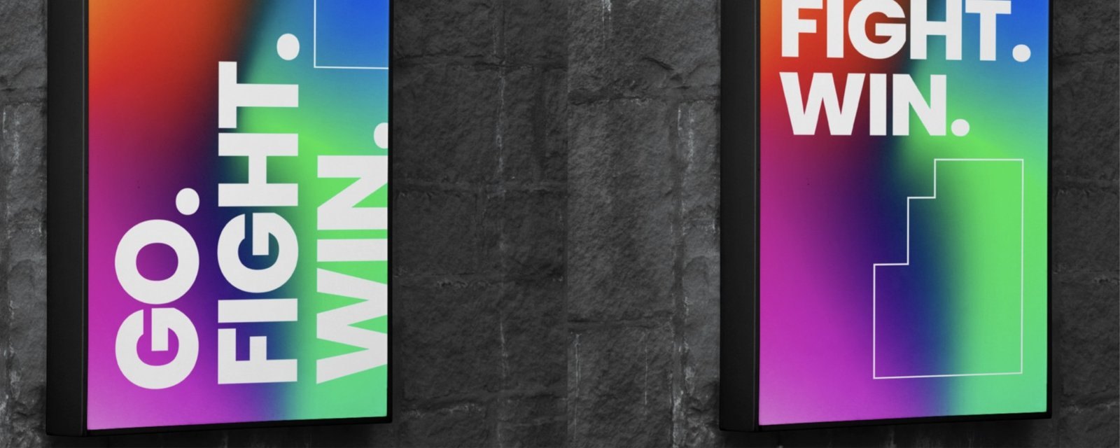 Two vertical digital signs reading Go. Fight. Win.