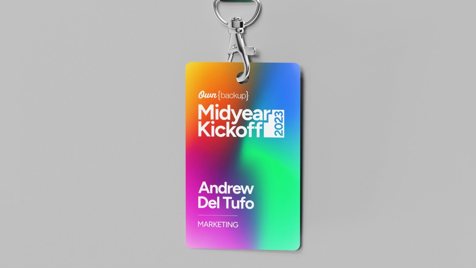 Gradient event ID badge on a lanyard clip