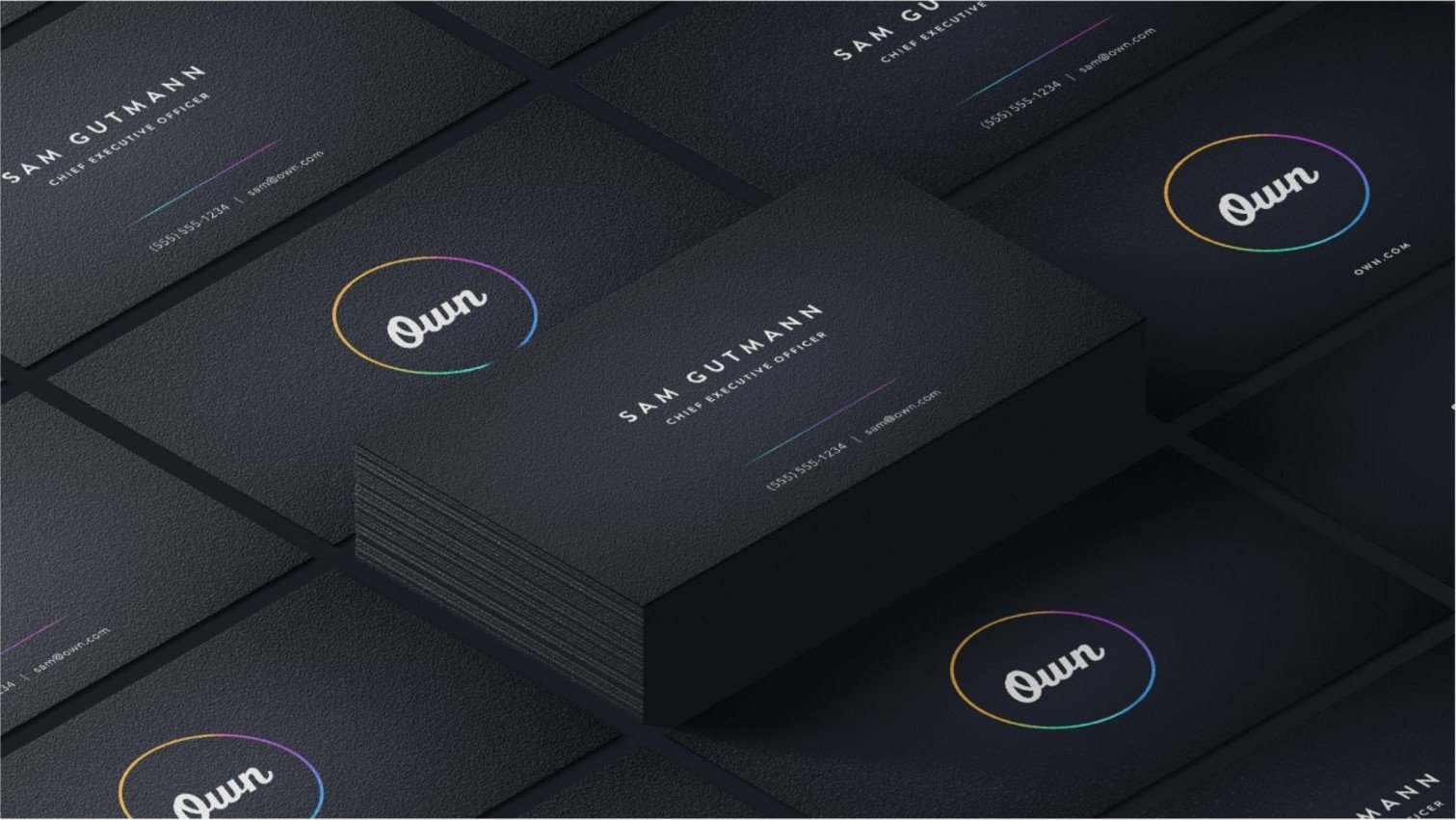 Dark business cards with the Own logo ring