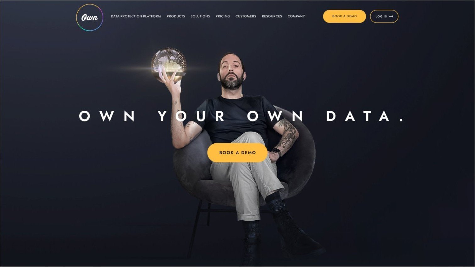 Own website hero with a man holding the orb